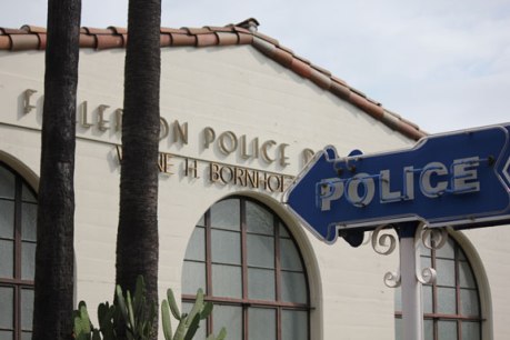 Police-sign-with-building-small